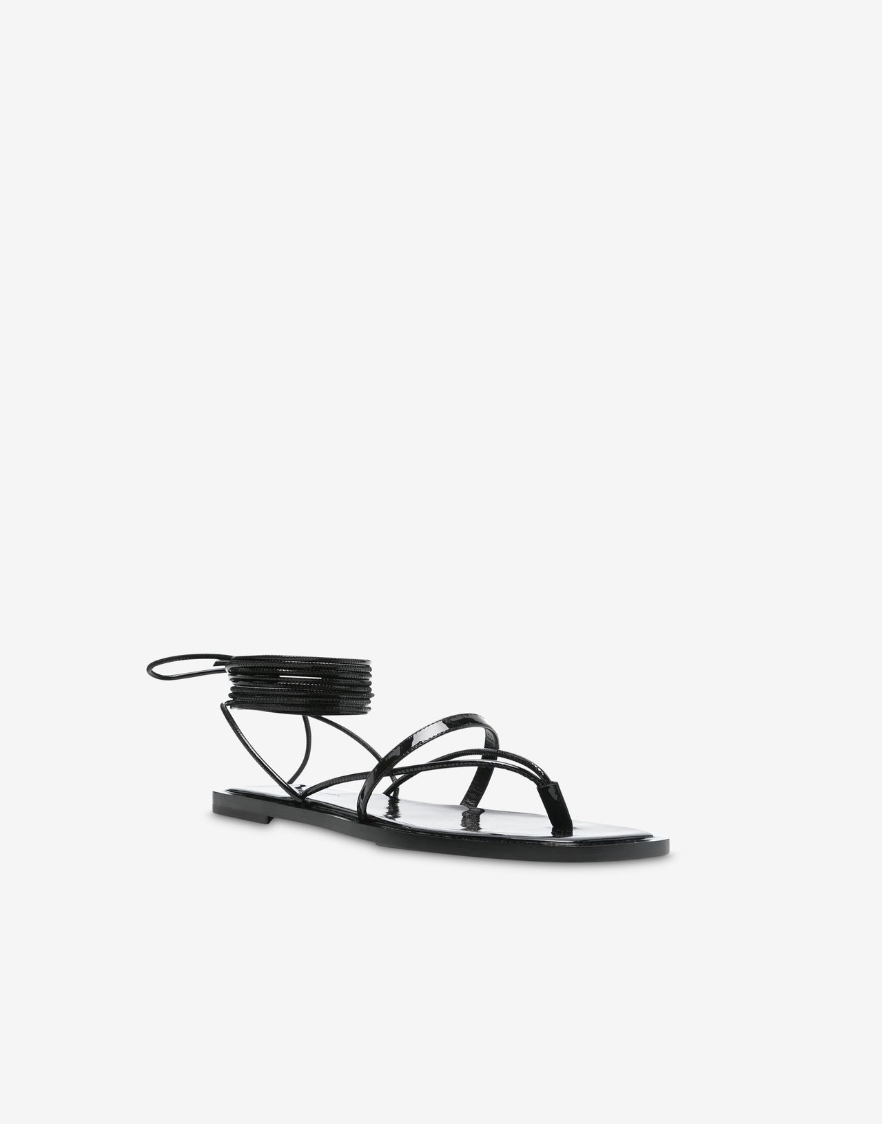 Black patent leather flat sandals with ankle straps